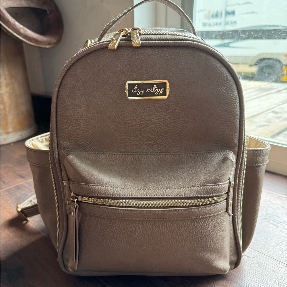 Itzy Ritzy mini Diaper bag and changing pad.